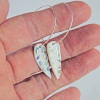 Hoop earrings with blue porcelain feathers
