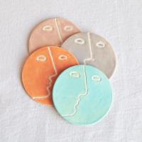 Face, coasters, pastel colour, mint, orange, pink, grey, porcelain face, ceramics with faces, face coasters, coasters with fa