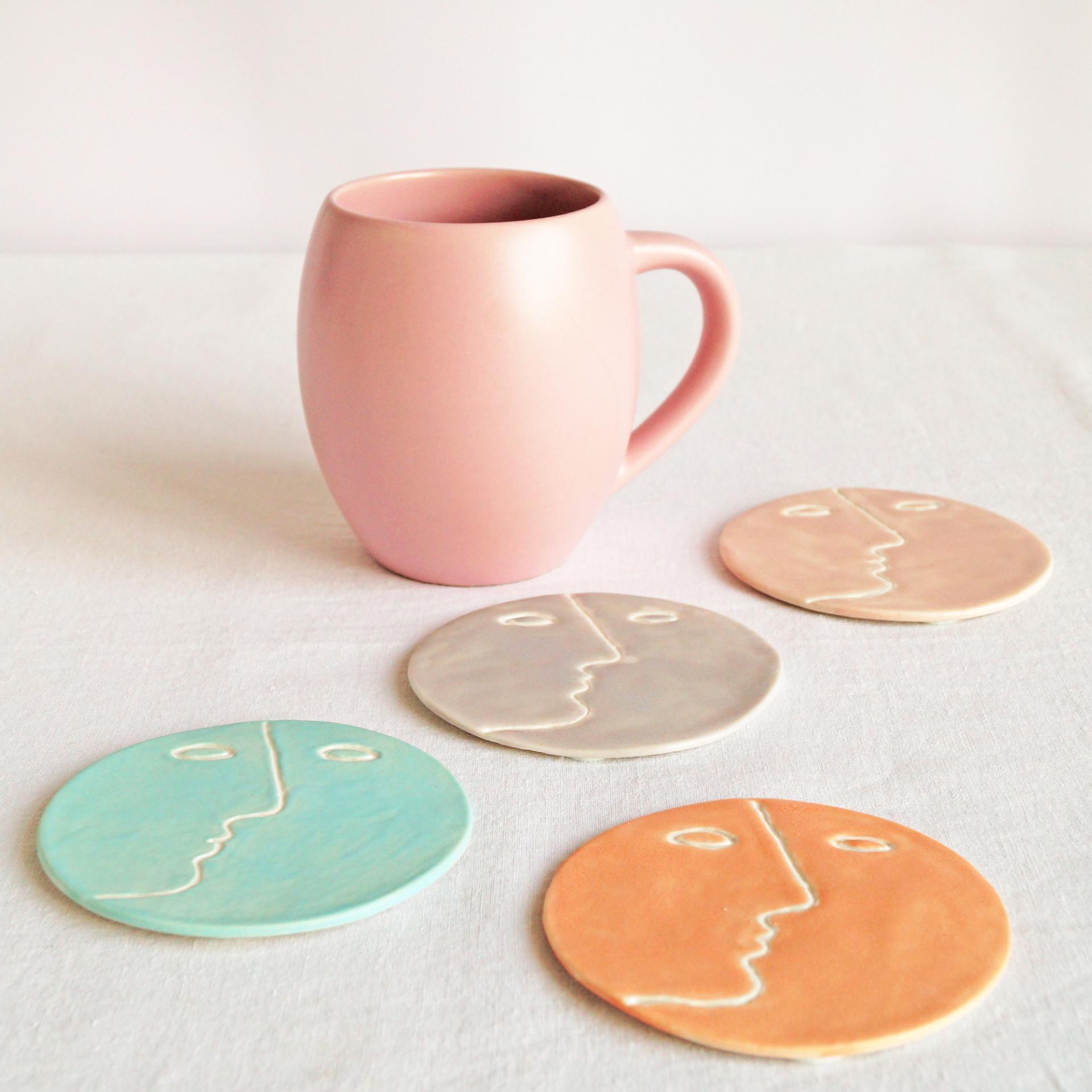 Face, coasters, pastel colour, mint, orange, pink, grey, porcelain face, ceramics with faces, face coasters, coasters with fa