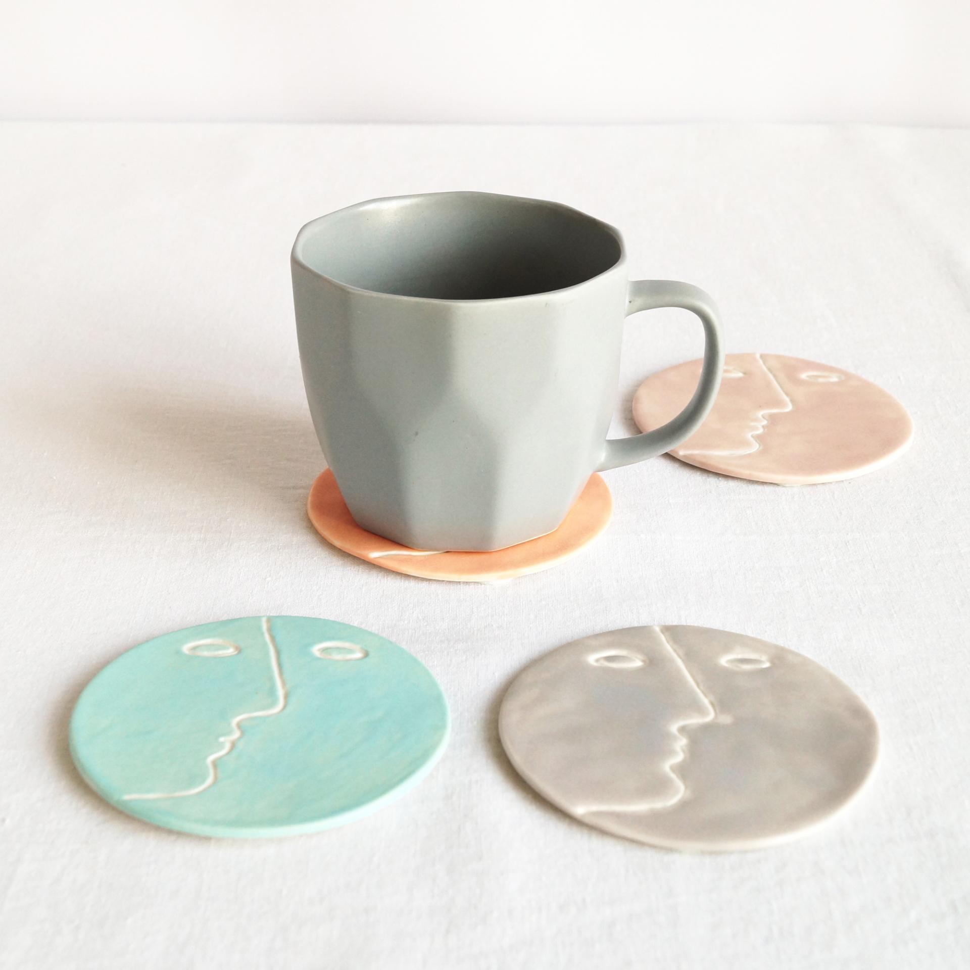 Face, coasters, pastel colour, mint, orange, pink, grey, porcelain face, ceramics with faces, face coasters, coasters with fa